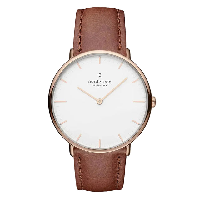 A rose gold-colored watch with a white dial and a brown leather strap, featuring markings and a logo on the face.