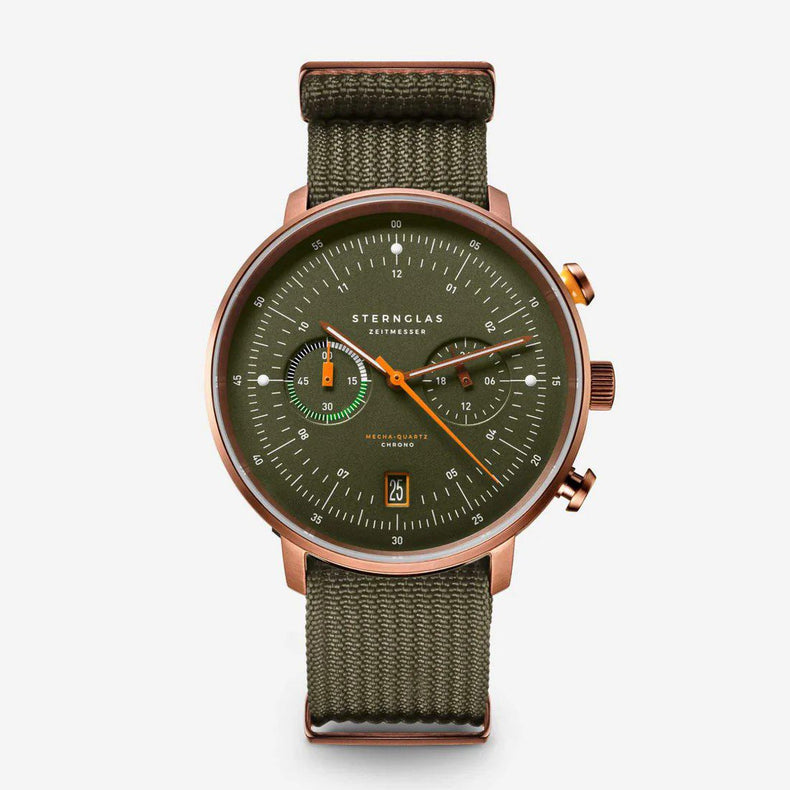 Sternglas London chronograph watch with an olive green dial and matching green canvas strap, featuring a rose gold-toned case and orange accents.