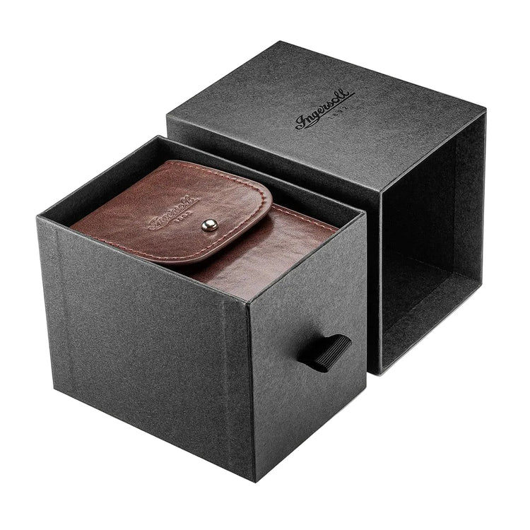 Brown leather pouch in a black box with a visible brand logo on a white background