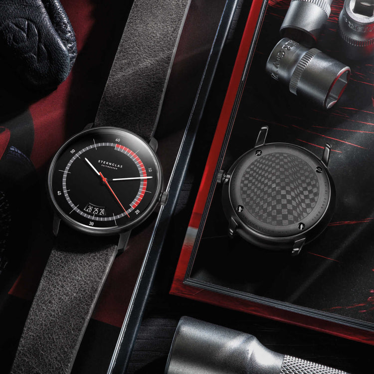 Sternglas | Naos Edition sports black 38mm red and black dial grey leather band | S01-NAS05-VI21