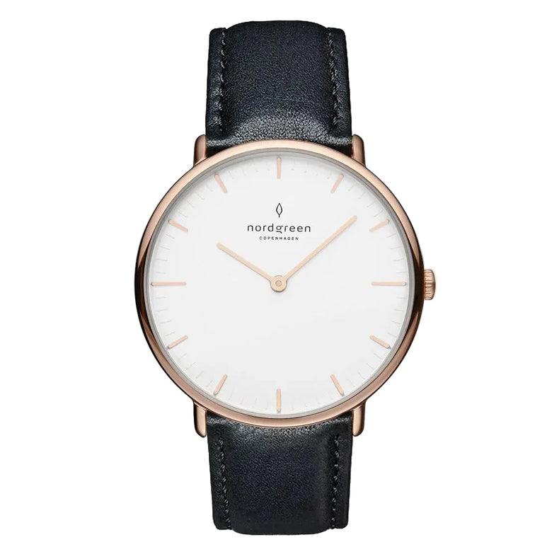 A women's watch with a rose gold PVD finish and a black leather strap, featuring a white dial with clear markings and the Nordgreen brand name.