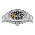 Silver watch with intricate design on a white background