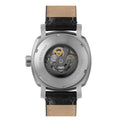 Watch with a black leather strap and visible mechanical components on a white background