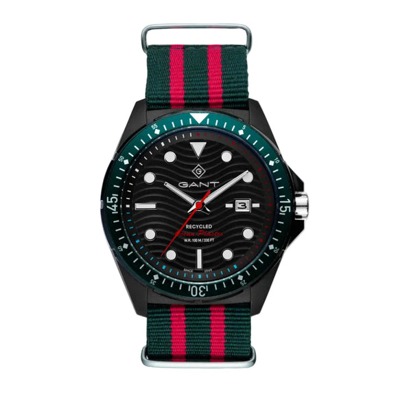 A Gant watch with a black dial and a multicolored red and green Ocean Plastic NATO strap, featuring a case with a black band and a blue textured dial.