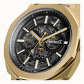 Gold wristwatch with a transparent face displaying mechanical components on a white background