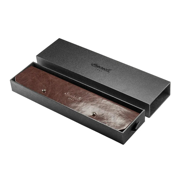 Brown leather belt with silver buckle in a black box on a white background