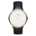 A women's watch with a white dial and black leather strap, featuring a gold PVD finish and the Nordgreen brand name.