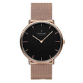 A rose gold-colored watch with a blue dial and a mesh strap, featuring clear markings and a luxury brand logo.