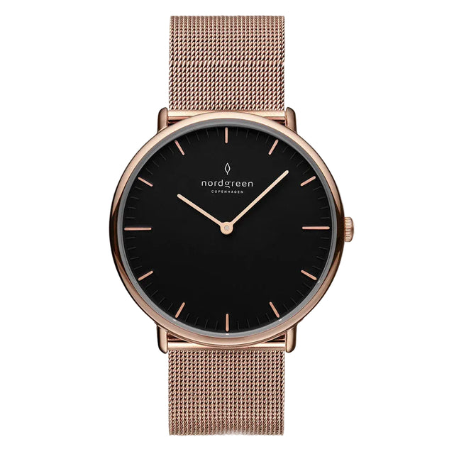 A rose gold-colored watch with a blue dial and a mesh strap, featuring clear markings and a luxury brand logo.