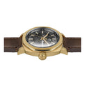 Gold wristwatch with a brown leather strap on a white background