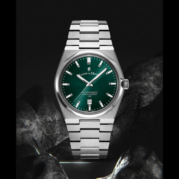 Silver watch with a green dial on a dark background