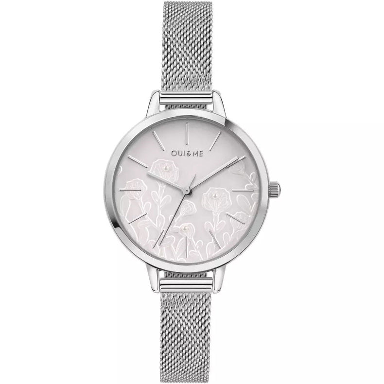 A silver-tone women's watch with a mesh metal strap, a round silver case, and a white dial featuring delicate floral line art and the brand name 'OUI & ME'.