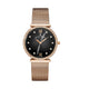 A women's watch by Jena-Maria featuring a round rose gold case, a black dial with Roman numerals, a bezel set with small clear crystals, and a matching rose gold mesh strap, shown against a plain white background.