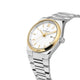 Silver and gold watch with white face on a white background