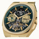Gold wristwatch with intricate design and visible brand name on a white background
