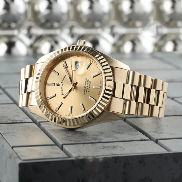 Gold watch with a detailed face on a textured surface