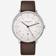 Watch with brown leather strap and white dial on a white background
