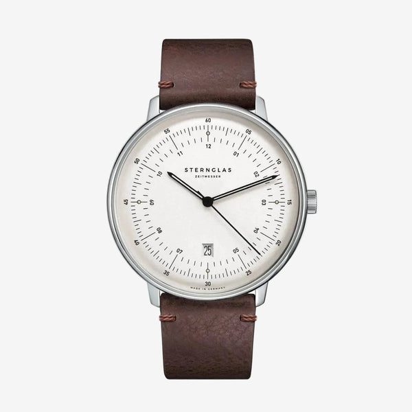 Sternglas watch with a brown leather strap, silver-toned case, and a white dial with black markings and hands, shown against a plain white background.
